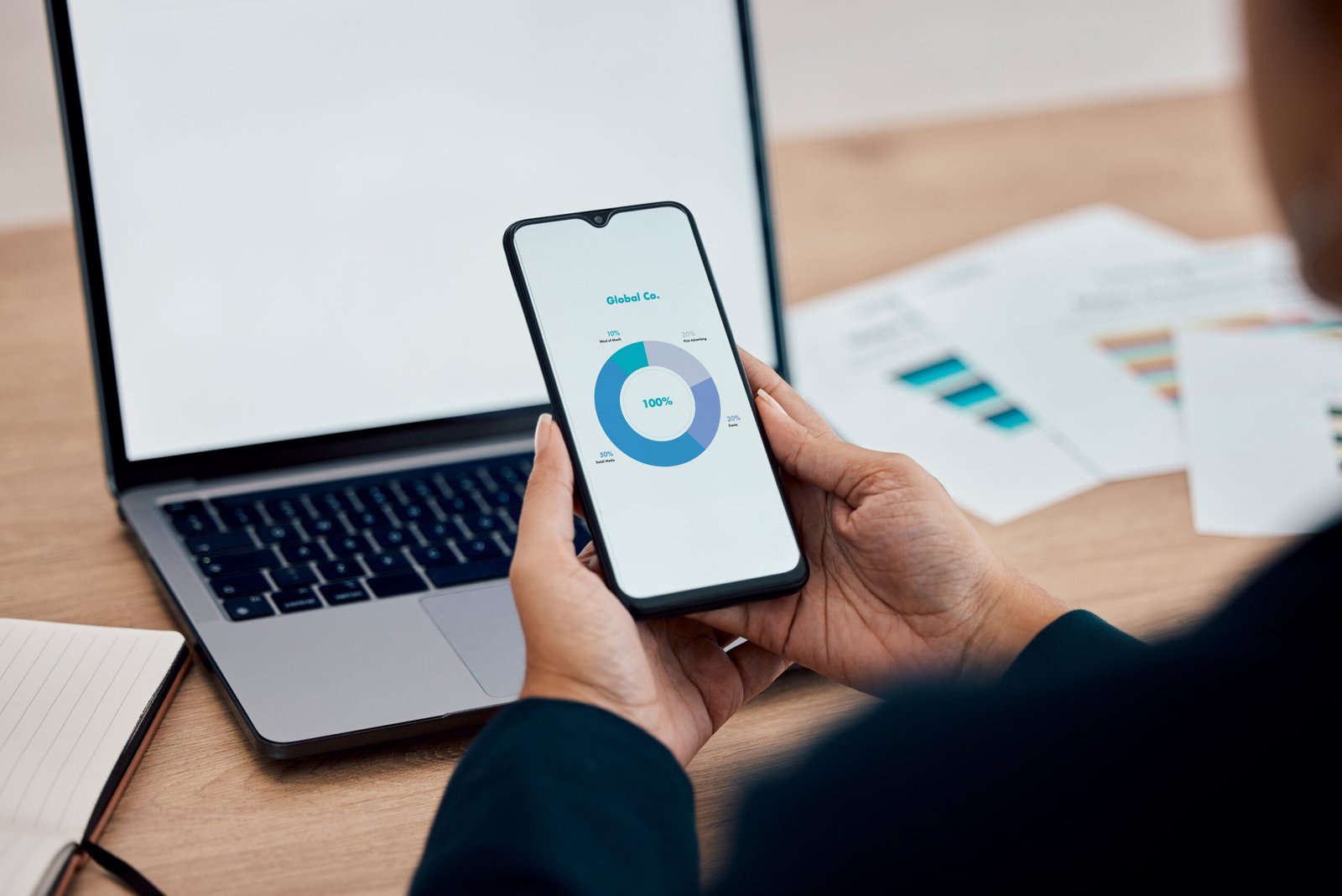 Closeup, business and employee with smartphone, mockup and data analysis for sales growth, global a.
