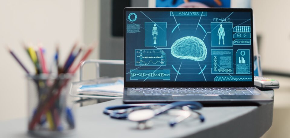 Laptop with human brain scan on desk, neurology x ray running on display in empty registration lobby. Diagnostic center with neural system tomography for neuroscience. Close up. Handheld shot.