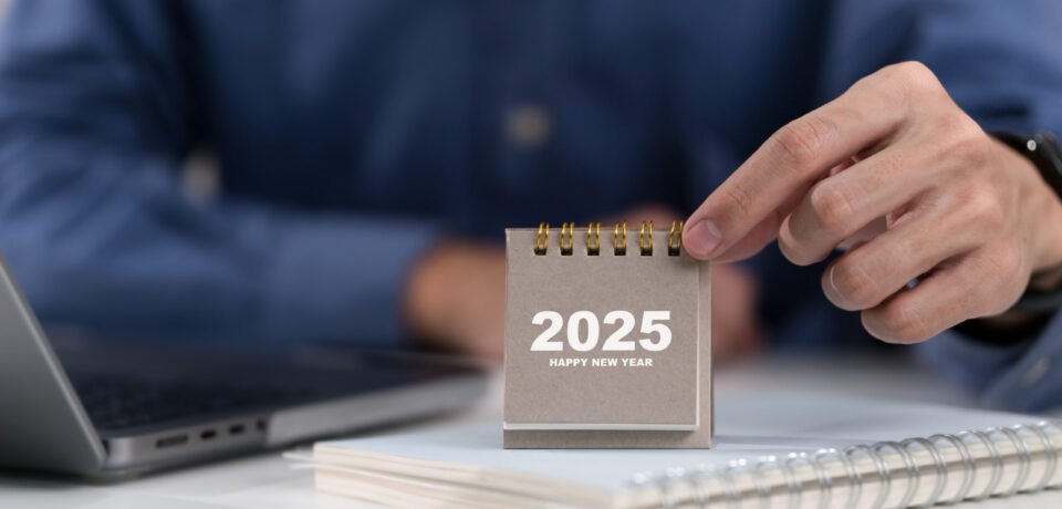Man hand holding 2025 calendar. 2025 Happy New year background. Setup objective target business cost and budget planning of new year concept.