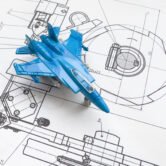 wooden model of the fighter plane on the background of a blueprint. High quality photo