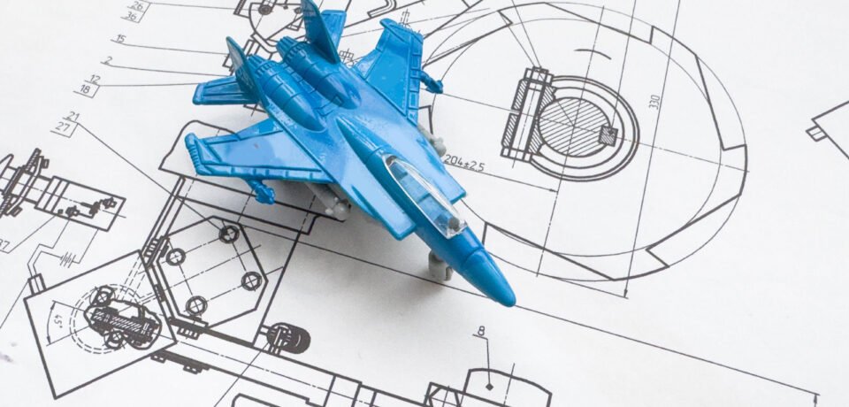 wooden model of the fighter plane on the background of a blueprint. High quality photo