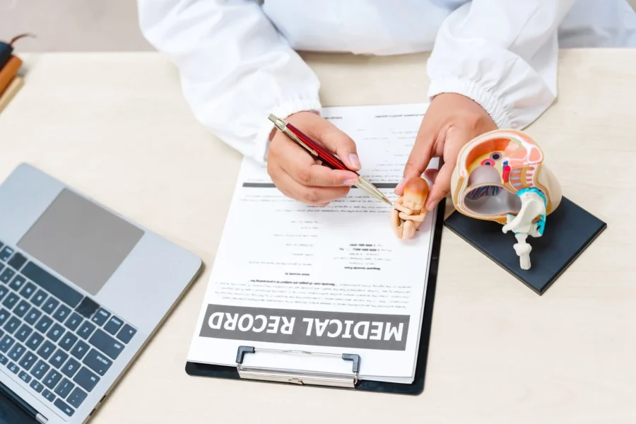 a-doctor-works-at-a-desk-with-a-model-of-a-female-2025-03-08-03-12-55-utc-scaled