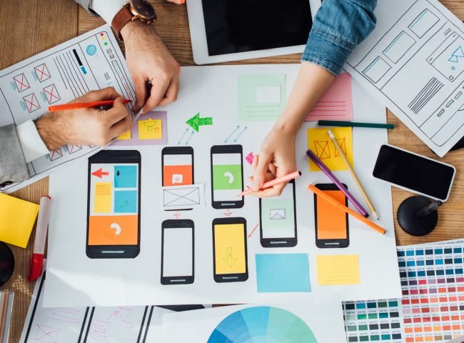 Top view of designers creative app interface for user experience design near layouts and digital Top view of designers creative app interface for user experience design near layouts and digital
